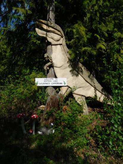 Herman the dinosaur - iconic sign at entrance to campground