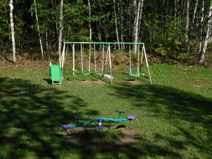 Swingset and teeter-totter at the campsite playground